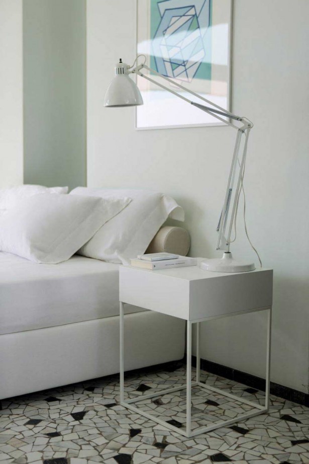 Stylish Nightstands Influenced By Nordic Furniture Designs: Extraordinary White Bedroom Furniture With Incredible White Table Lamp That Is Lying On The Modern White Nightstand Equipped Also With White Bedding And White Walls ~ Indiepublic.com
