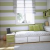 Lovely Interior Decorating Ideas of Girls’ Bedroom in Attractive Themes: Captivating Modest Girls Bedroom Painted In Horizontal Striped Motives Of White And Green Tones Completed With Green Wall Mounted Open Shelves An Ample White Cupboard