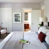 Enthralling Door Design to Greet and Welcome Your Guests with Impression: Lovely Minimalist White Doors In Vary Sizes In An Elegant Room With A Huge Bed Equipped With Cushions In Vary Shapes And Design With A Reading Corner Near The Window