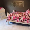 Lovely Interior Decorating Ideas of Girls’ Bedroom in Attractive Themes: Stunning Minimalist Grayish Bedroom Girls Decoration With Bed Frame With Carved Edges Completed With Barbie House In The Corner And White Wooden Table Near The Bed