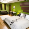 Appealing Bedroom Decorating Ideas with the Addition of Sofa for a Perfect Final Display: Serene Bold Green Bedroom Paint Ideas With Remarkable Mid Century Style Black Sofa Placed Near The Stunning Home Office Completed With Beautiful Bedcover And Pillows With Floral Motive