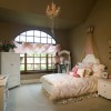 Lovely Interior Decorating Ideas Of Girls’ Bedroom In Attractive Themes: Endearing Girls Bedroom Interior Design In Bold Beige Tone With Pretty Chandelier Illuminates The Spacious Area Completed With Classic And Elegant White Cupboard And Bed Frame