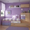 Lovely Interior Decorating Ideas Of Girls’ Bedroom In Attractive Themes: Appealing Girls Bedroom Interior Design In Bold Purple With White Ceiling Completed By Wall Mounted Open Shelves And Compact Bed Frame With A Window At The Corner Spot