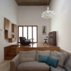 Prodigious Modern Home Architecture In Malta: Awesome Small Living Room Design Equipped With Grey Corner Sofa And Beautiful Area Rugs As Well As Unique Pendant Lamp Plus Wooden Flooring