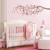 Appealing Wall Painting Designs For Chic Bedroom: Baby Bedroom Themes With Pink Wall And White Cot With Small Table And Table Lamp With Beige Curtain And White Armchair With Wall Sticker Decor