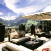 Dazzling Hotel Interior in Switzerland Reveals Spectacular Mountain Views: Balcony Design Ideas In Simple Home Decorating Ideas With Black Coffee Table And Comfortable Sofa With Wood Flooring Laminate