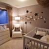 Charming Baby Room Decorating Ideas with Awesome Interior Design: Brown Baby Bedroom Colors With Modern Cot With Chest Of Drawers And Floor Lamp Beside White Armchair With Brown Pillow With Wall Ornaments