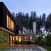 Enchanting Residence Showing White in Black Details from UN Arquitectura: Contemporary House Design Surrounded Fresh Green Tree Equipped With Amazing Exterior Design Such As Laminate Wood Flooring And Outdoor Swimming Pool