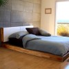 Adorning Modern Bedroom Design Ideas With Awesome Details: Simple Bedroom Design With Plant And Concrete Wall And Wooden Laminate Floor With Wonderful Outside View