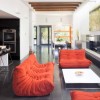 Delightful Togo Sofas with Stylish Design: Togo Orange Sofa And White Table In Modern Living Room