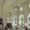 Admirable High Ceiling Ideas For Living Room: Tremendous White Living Room Design Adorned With High Ceiling And Wall Mirror Plus White Sofa Armchairs With 2 Table Lamps