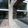 Charming White Details Dominate Impeccable Minimalist Home in Germany: Wood Laminate Flooring And Stone Fence Adorn Contemporary Home Design