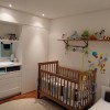 Charming Baby Room Decorating Ideas With Awesome Interior Design: Wooden Cot Design For Baby Bedroom With Wall Shelves And White Door With Round Rug With Wooden Floor And White Wall With Wall Shelving