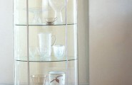 Glass Cabinets for a Chic Display in Magnificent Interior Décor : Beautiful Round Shaped Of Occasional Glass Display Unit For Showing Artistic Collection At The Corner Of Luxurious Drawing Room
