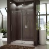 Eye-catching Sliding Shower Doors for Elegant Bathroom: Magnificent Apartment Bathroom Decorating Ideas Completed With Glass Sliding Shower Door Plus Fabulous White Bathtub And 2 Plants