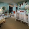 Fun Nursery Designs With Decorative Themes: Nursery Interior Design Adorned With Round Mirror On The Wall Plus White Baby Cots Near Rocking Chair And Floor Lamp