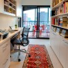 10 Eye-catching Home Office Designs with Creative Ideas: Office Bookshelves And Persian Rug Added With Black Swivel Chair And Narrow Desk For Minimalist Home Office Design