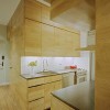 Fascinating New York Apartment Interiors with Clever Design Ideas: Small Contemporary Kitchens With White Kitchen Backsplash And Stainless Steel Countertops Also Wooden Cabinets