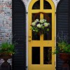 Marvelous Front Door Designs Revealing Adorable Home: Wreath For Front Door As Well As Rustic Brick Wall For Traditional Home Design