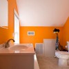 Flashy Orange Details Refreshing Attractive Bathroom Design: Attic Bathroom Design With Orange Color Equipped With Window And White Washbasin