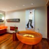Flashy Orange Details Refreshing Attractive Bathroom Design: Extraordinary Orange Round Bathtub And Attractive Orange Washbasin With Wooden Flooring For Contemporary Interior Design Bathroom