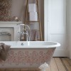 Enchanting Bathroom Design High Quality And Value To Your Home Décor: Idyllic White Bathtub With Beutiful Patterned Floral Motif Around Its Outer Surface In A Vintage Bathroom With Wooden Flooring And White Door
