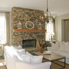 10 Astonishing Stone Fireplaces Brings Nature Materials at Home: Impressive Stone Fireplace Ideas For Incredible Living Rooms With Two Astounding White Sofas As Well As Square Coffee Table