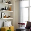 Brilliant Apartment Decor Ideas For Tiny Apartment: Lovely Curtains And Floating Shelves Plus Two Pouffe With Round Black Coffee Table